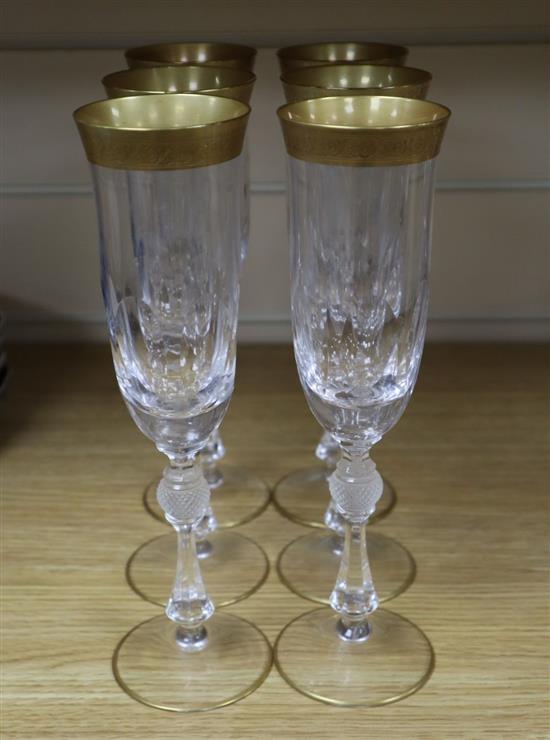 A set of six Bohemian gilt rimmed champagne flutes, 24cm